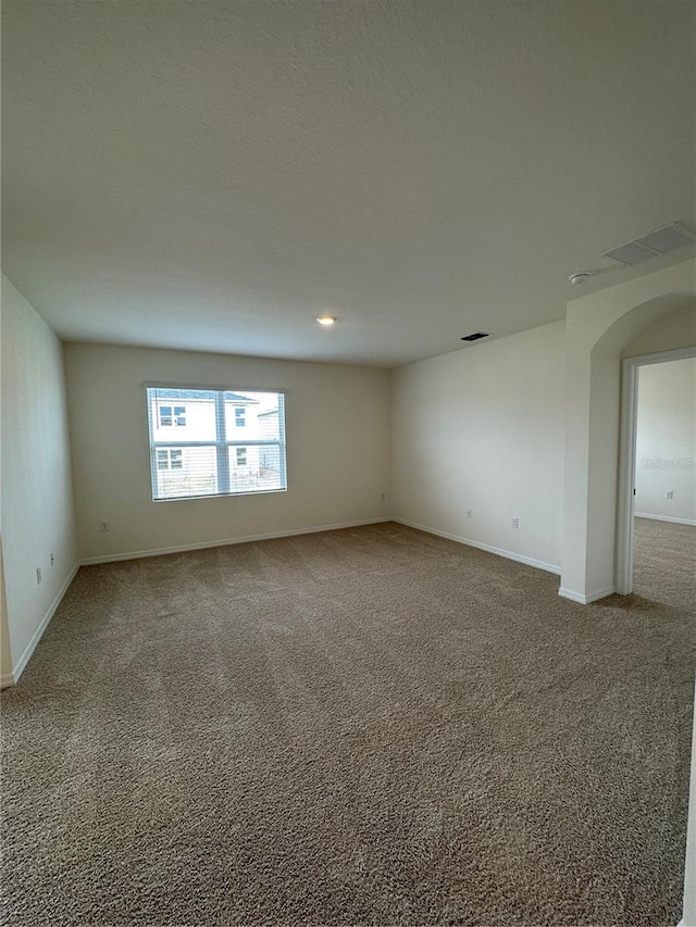 empty room featuring carpet floors