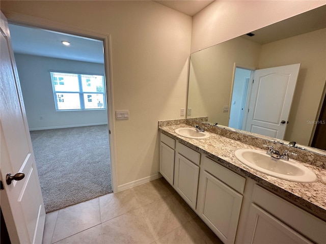 bathroom featuring tile patterned flooring and vanity