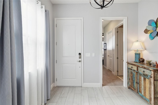 5075 Twin Lakes Blvd, Saint Cloud, FL 34772 - foyer with a chandelier and baseboards