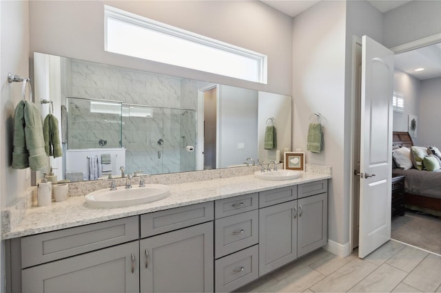 bathroom featuring vanity and a shower with shower door