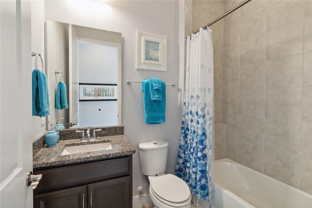 full bathroom with shower / bath combo with shower curtain, vanity, and toilet