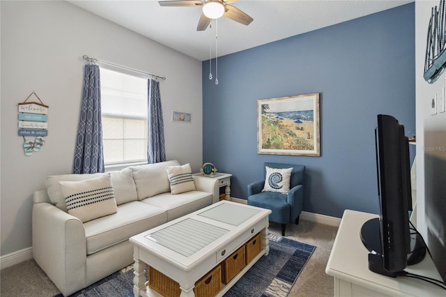 living room with ceiling fan and dark carpet