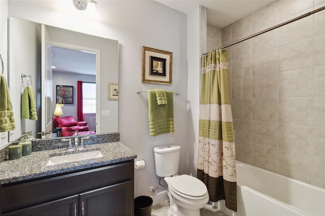 full bathroom with vanity, shower / bath combo with shower curtain, and toilet