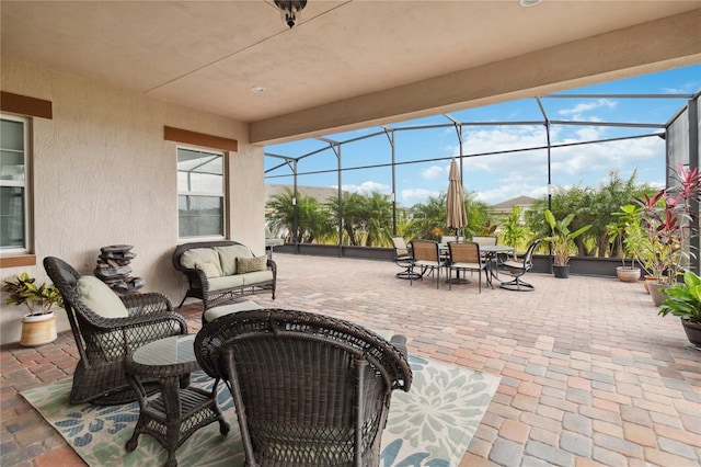 5075 Twin Lakes Blvd, Saint Cloud, FL 34772 - view of patio with glass enclosure, outdoor lounge area, and outdoor dining space