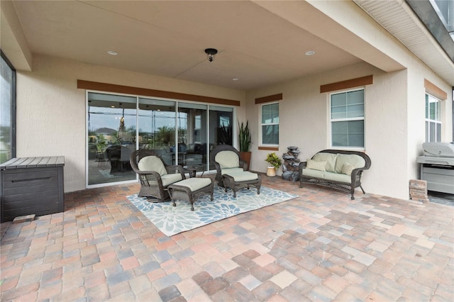 view of patio with an outdoor hangout area and grilling area