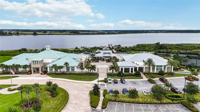 birds eye view of property with a water view