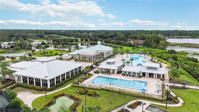 5075 Twin Lakes Blvd, Saint Cloud, FL 34772 - drone / aerial view of a pool area, a large body of water, and a tree filled landscape