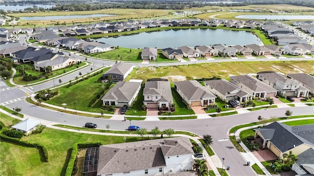 5075 Twin Lakes Blvd, Saint Cloud, FL 34772 - aerial overview of property's location with nearby suburban area and a large body of water