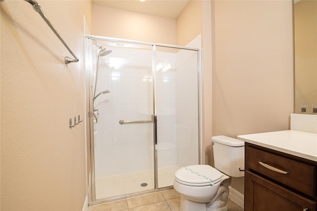 bathroom with tile patterned flooring, vanity, toilet, and a shower with shower door