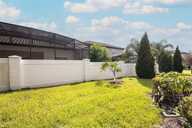 view of yard featuring a lanai