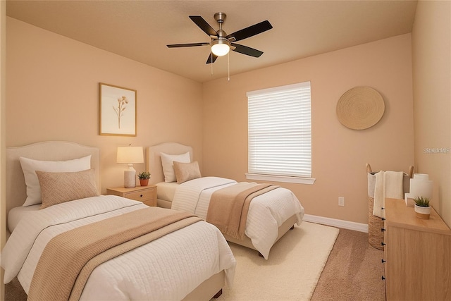 7845 Wandering Way, Orlando, FL 32836 - bedroom with light colored carpet, baseboards, and a ceiling fan