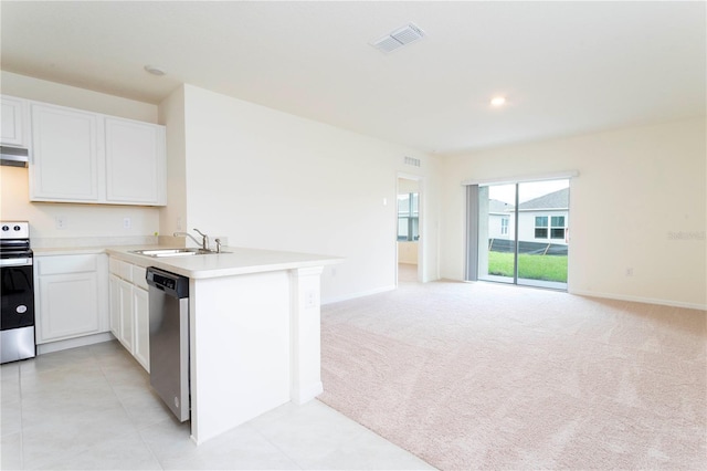 kitchen featuring stainless steel appliances, white cabinets, sink, and kitchen peninsula