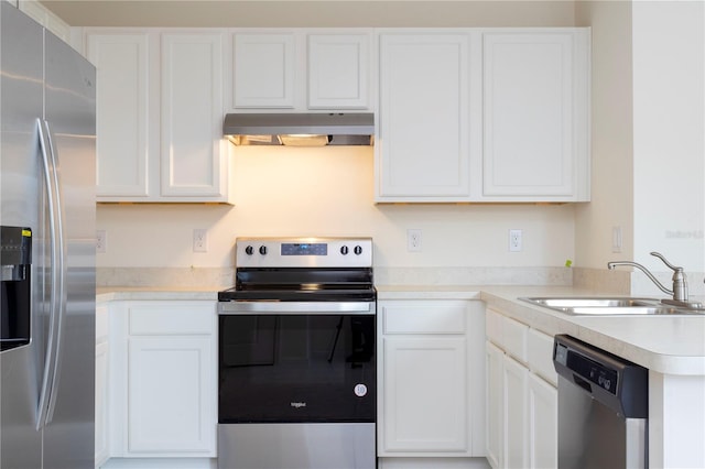 kitchen with sink, white cabinets, extractor fan, and appliances with stainless steel finishes