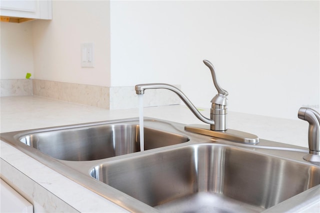 room details with sink and white cabinets