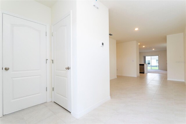 hallway with light tile patterned flooring