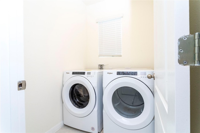 clothes washing area with independent washer and dryer