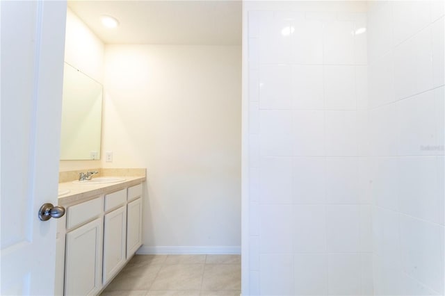 bathroom featuring tile patterned flooring and vanity