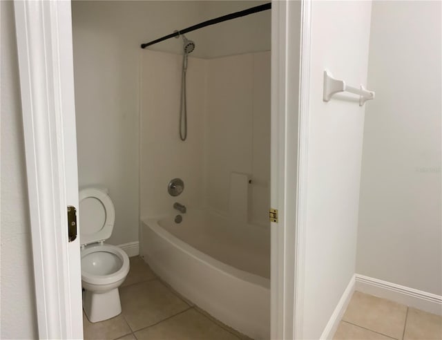 bathroom with toilet, tile patterned floors, and  shower combination