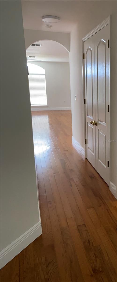 corridor featuring hardwood / wood-style floors