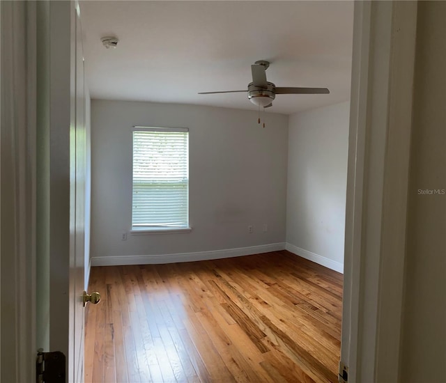 empty room featuring light hardwood / wood-style floors and ceiling fan