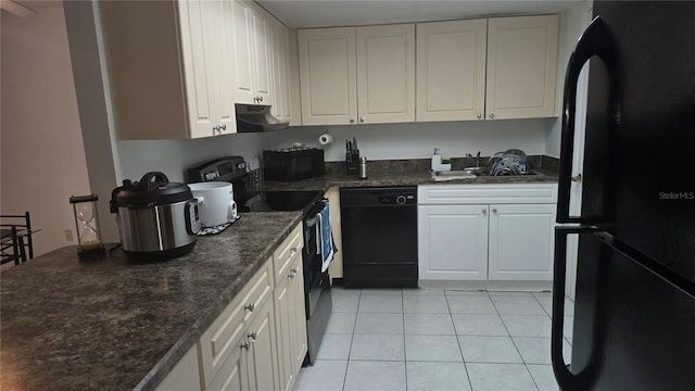 kitchen featuring white cabinetry, light tile patterned flooring, sink, and black appliances