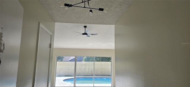 room details featuring a textured ceiling and ceiling fan