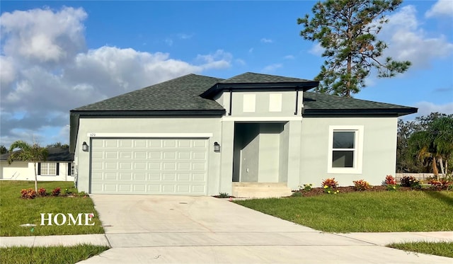 view of front of house with a garage and a front yard