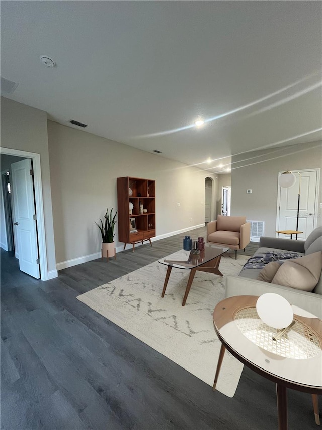 living room with dark hardwood / wood-style floors