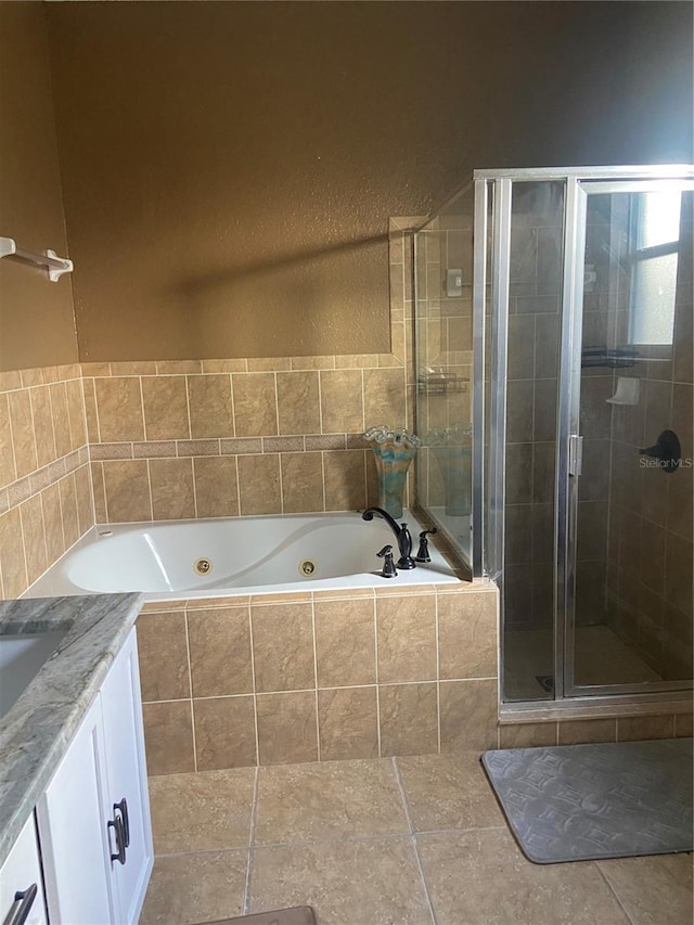 bathroom with shower with separate bathtub and vanity