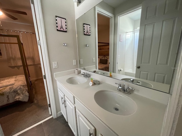 bathroom featuring vanity, ceiling fan, tile patterned floors, and a shower