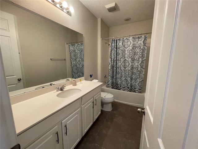 1799 Caribbean View Ter, Kissimmee, FL 34747 - bathroom featuring tile patterned flooring, vanity, a textured ceiling, toilet, and shower / bath combination with curtain