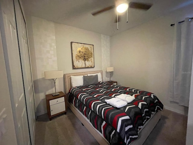 bedroom featuring dark colored carpet and ceiling fan