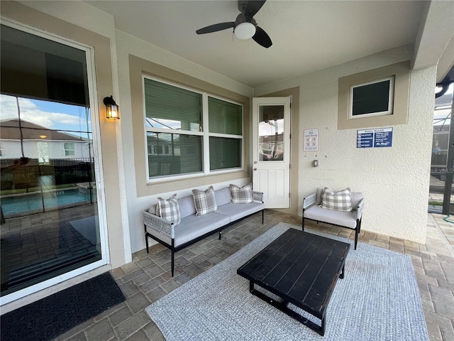 view of patio with outdoor lounge area and ceiling fan