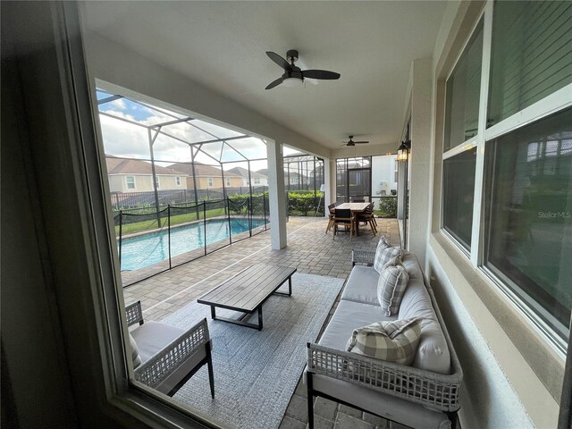1799 Caribbean View Ter, Kissimmee, FL 34747 - view of patio featuring an outdoor hangout area, an outdoor pool, ceiling fan, and a lanai
