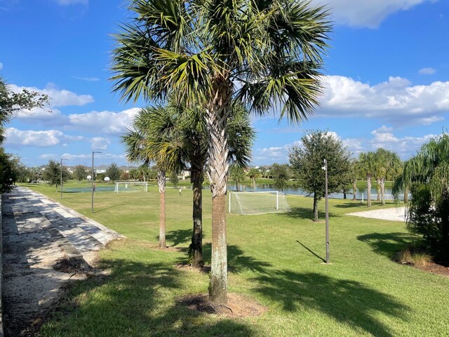 1799 Caribbean View Ter, Kissimmee, FL 34747 - view of community featuring a sport area and a water view