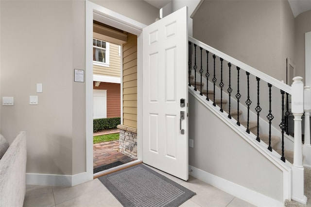 foyer entrance featuring light tile patterned flooring