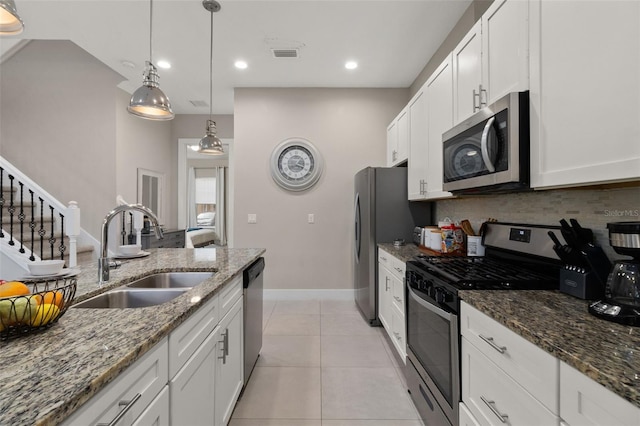 kitchen featuring sink, white cabinets, and appliances with stainless steel finishes