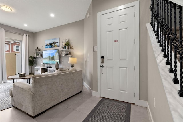 foyer entrance featuring light tile patterned flooring