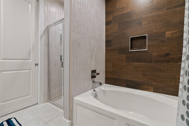 bathroom with tile patterned flooring and independent shower and bath