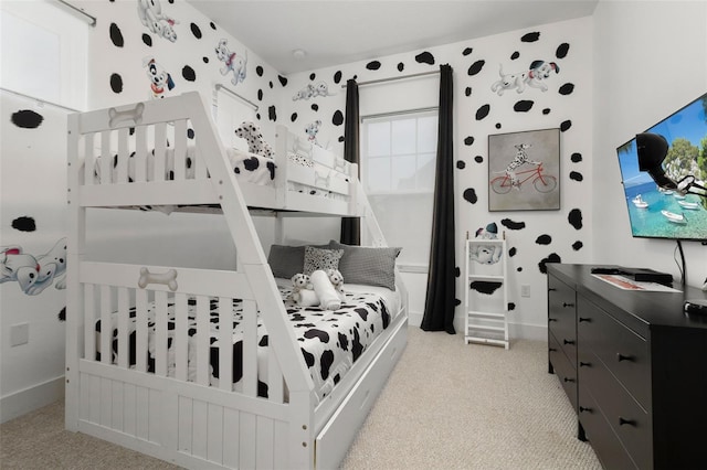 bedroom featuring light colored carpet and multiple windows