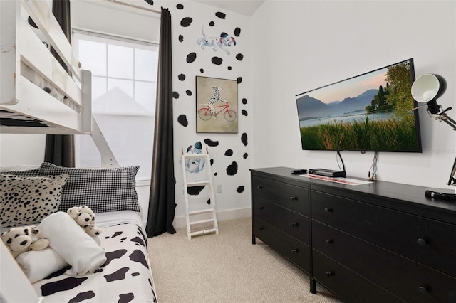 bedroom featuring light colored carpet