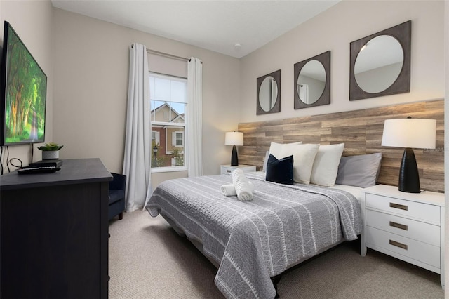 carpeted bedroom with wood walls