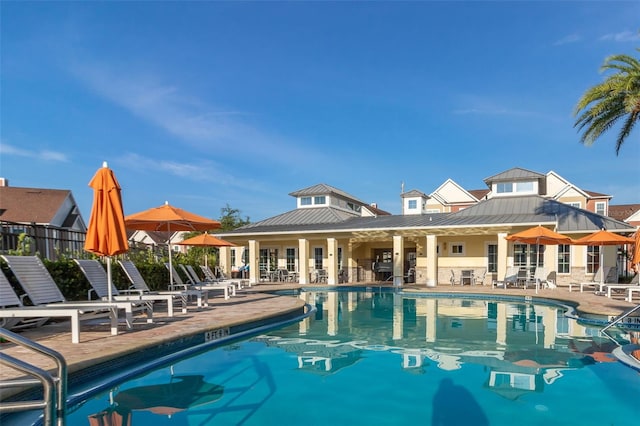 view of swimming pool with a patio