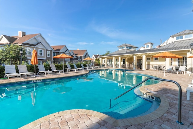 view of swimming pool featuring a patio area