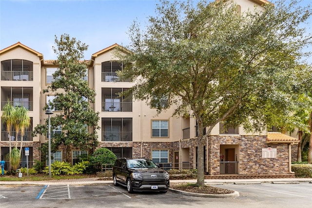 1301 Tuscan Ter Unit 9106, Davenport, FL 33896 - view of building exterior with uncovered parking