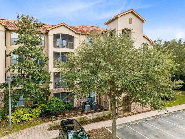 1301 Tuscan Ter Unit 9106, Davenport, FL 33896 - view of building exterior with uncovered parking