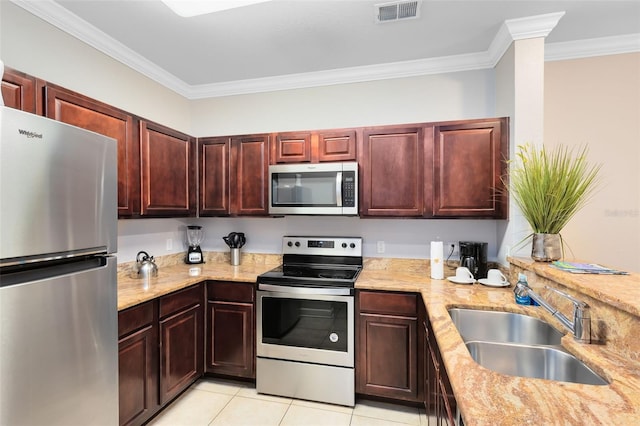 kitchen featuring crown molding, sink, light tile patterned floors, appliances with stainless steel finishes, and light stone counters