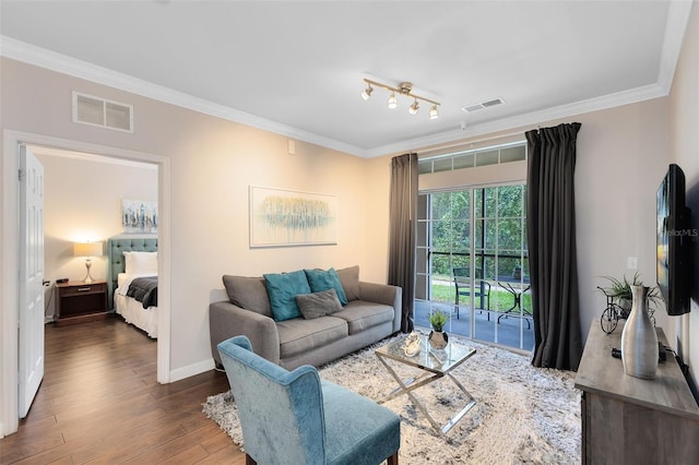 living room with dark hardwood / wood-style floors and ornamental molding