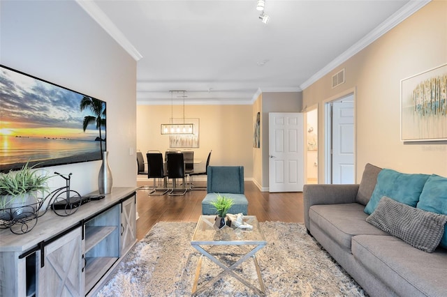 living room featuring dark hardwood / wood-style floors and ornamental molding