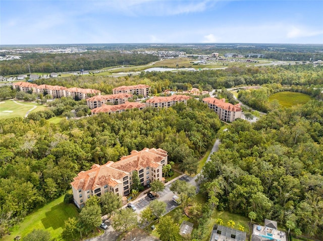 1301 Tuscan Ter Unit 9106, Davenport, FL 33896 - view of property location with apartment complex, a heavily wooded area, a golf club, and a nearby body of water